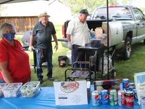 Volunteering at the barbecue are (from left) Gloria Waldroff, Richard Waldroff and Tim Gault. Photo on Saturday, September 11, 2021, in Long Sault, Ont. Todd Hambleton/Cornwall Standard-Freeholder/Postmedia Network