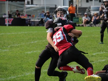 Cornwall Wildcats Mosquito Division team ball carrier Jaxson Berniquer collides with a South Gloucester Raiders player. Photo on Sunday, September 12, 2021, in Cornwall, Ont. Todd Hambleton/Cornwall Standard-Freeholder/Postmedia Network