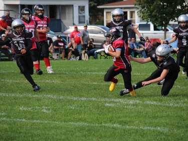 Nathan Major of the Cornwall Wildcats Mosquito Division team, breaking away from a South Gloucester Raiders tackler. Photo on Sunday, September 12, 2021, in Cornwall, Ont. Todd Hambleton/Cornwall Standard-Freeholder/Postmedia Network
