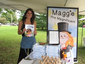 Children's book author Erin Lee, holding a copy of Out of Season, her second published book, at a vendor's market on the weekend in Long Sault. Photo on Saturday, September 11, 2021, in Long Sault, Ont. Todd Hambleton/Cornwall Standard-Freeholder/Postmedia Network