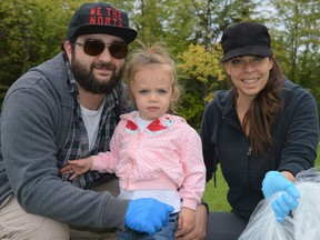 From left, Philippe Gauthier, Michelle Gauthier and Kelly Sayegh were helping to during the Big Litter Cleanup. Michelle, 2, was the youngest participant of the inaugural event on Saturday September 18, 2021 in Cornwall, Ont. Shawna O'Neill/Cornwall Standard-Freeholder/Postmedia Network