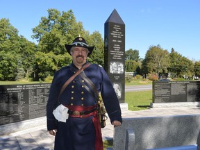 Vince Chiarelli, an executive with The Grays and Blues of Montreal, posing with the American Civil War monument at the Lost Villages Museum on Sunday September 19, 2021 in Long Sault, Ont. Shawna O'Neill/Cornwall Standard-Freeholder/Postmedia Network