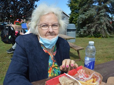 Heather Machaffie enjoying some of the food and sun during the third Iroquois Apple Festival on Saturday September 18, 2021 in Iroquois, Ont. Shawna O'Neill/Cornwall Standard-Freeholder/Postmedia Network