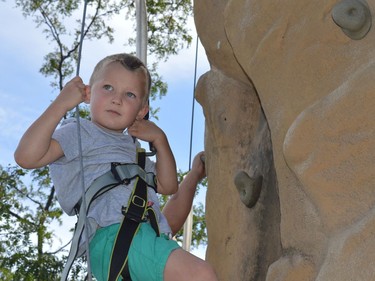 Blake Foster tried out the rock climbing wall at the Iroquois Apple Festival on Saturday September 18, 2021 in Iroquois, Ont. Shawna O'Neill/Cornwall Standard-Freeholder/Postmedia Network