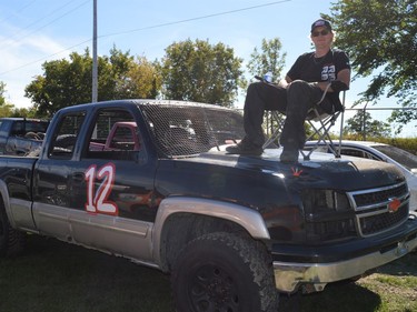 John Marti sitting with his father's truck before it took to the track on at the Fireball Enduro Saturday September 18, 2021 in Cornwall, Ont. Shawna O'Neill/Cornwall Standard-Freeholder/Postmedia Network