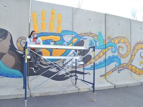 Victoria Ransom of Akwesasne felt that painting a mural at the basketball courts on Kawehno:ke (Cornwall Island) was something she had to do for National Day of Truth and Reconciliation on Thursday September 30, 2021 in Akwesasne, Ont. Shawna O'Neill/Cornwall Standard-Freeholder/Postmedia Network