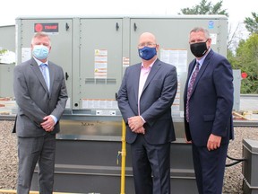 Leeds-Grenville-Thousand Islands and Rideau Lakes MPP Steve Clark, centre, with Catholic District School Board of Eastern Ontario director of education John Cameron, left, and board chair Todd Lalonde, right, atop St. Mary Catholic High School in Brockville. Seven new HVAC units were installed at the school this summer. (SUBMITTED PHOTO)