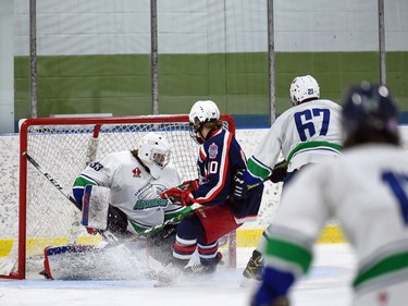 Cornwall Colts Tristan Miron forces Hawkesbury Hawks goaltender Sasha Gaumond to hold the puck during exhibition play against the Cornwall Colts on Friday September 17, 2021 in Hawkesbury, Ont. Cornwall won 4-2. Robert Lefebvre/Special to the Cornwall Standard-Freeholder/Postmedia Network