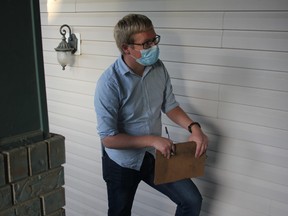 Leduc council incumbent Lars Hansen chats with a resident in the Windrose neighbourhood Sept. 22 on one of his regular door knocking outings.