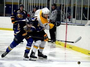 Fort McMurray Oil Barons forward Pana Efraimidis battles Grande Prairie Storm forward Grayden Alexander for the puck at the Frank LaCroix Arena on Friday, September 10, 2021. Laura Beamish/Fort McMurray Today/Postmedia Network