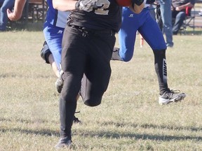 Hanna Hawks #32 Gavin Brady brings the ball down the field during the Sept. 24 home game against the Camrose Royals. The Hawks took home the win with ease against the Royals, wwho had a short bench, with a final score of 82-7. Jackie Irwin/Postmedia