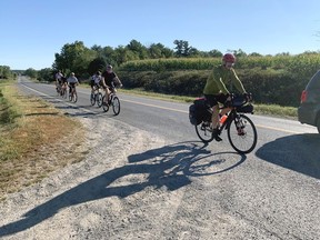 Const. Richard Martin, first cyclist, leds a group of riders on the first leg of the Boots on the Pedals fundraiser for the Boots on the Ground peer support organization on Saturday, Sept. 4, 2021. That morning the group road from the Frontenac Detachment in Harrington to the Lennox and Addington Detachment in Napanee. In the afternoon they traveled from Napanee to the Thousand Islands Detachment in Lansdowne.