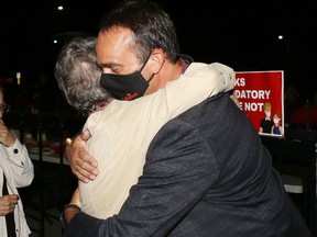 Kingston and the Islands Liberal candidate Mark Gerretsen hugs a supporter after being re-elected in the federal election on Monday.