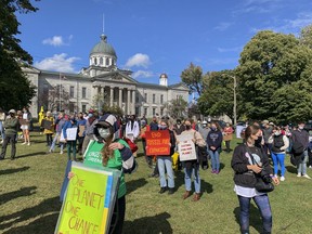 Climate protesters gather in City Park on Friday to demand immediate climate action from all three levels of government.