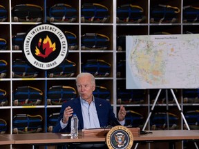 US President Joe Biden speaks during a briefing at the National Interagency Fire Center at Boise Airport on September 13, 2021, in Boise, Idaho. - US President Joe Biden kicked off a visit to scorched western states Monday to hammer home his case on climate change and big public investments, as well as to campaign in California's recall election. (Photo by Brendan Smialowski / AFP)