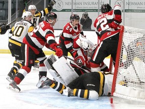 Kingston Frontenacs forward Lucas Edmonds (in net) scores his first of two goals against the Ottawa 67's in an Ontario Hockey League pre-season game at the Leon's Centre in Kingston on Saturday, Sept. 18, 2021.