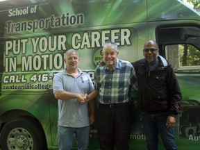 Grand Bend's Norm Tufts, centre, recently donated about 65 boxes of his Ford Canada archives to the Centennial College School of Transportation. The archives consist of technical information and manuals for Ford Canada vehicles from the 1940s to 1989. Centennial College School of Transportation technologists Robert Paul, left, and Iqbal Hosein, right, visited Tufts' home Sept. 8 to collect the archives, which the college will use for research.