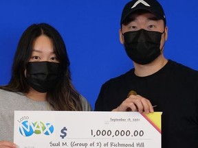 Sual Hong Min and Jonathan Chang, of Richmond Hill, with their Lotto Max winnings.