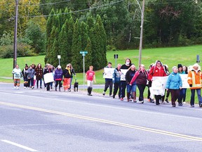 Photo by KEVIN McSHEFFREY/THE STANDARD
As many as 30 women, men and children took part in this year's Take Back the Night march that started at the Upper Plaza parking lot and ended at the Miners Memorial Park where there was a group awaiting their arrival. For the full story, see page 2.