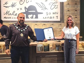 Photo by JESSICA BROUSSEAU
Manager Kate Collett is joined by Elliot Lake Mayor Dan Marchisella for the grand opening of Miss Jones on Sept. 4.