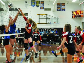 J.T. Foster Knight Jessica Marthaller hits the volleyball over the net Sept. 17 during the junior varsity team's game against Vulcan's County Central High School at a tournament County Central hosted Sept. 17-18. The Raiders lost this match, their first of the tournament, but ended up finishing fourth at the tournament.