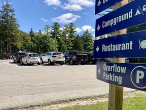 Signs point to parking areas at Harrison Park in Owen Sound. DENIS LANGLOIS