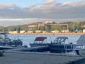 A long line of travel trailers and tents can be seen along the east wall of the Owen Sound Harbour, across from the west-side boat launch, just before the sun sets on another day of the Owen Sound Salmon Spectacular fishing derby on Thursday.
Denis Langlois