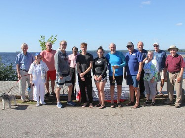 Kiwanis Club of Pembroke members, sponsors and participants in the 2021 Kiwanis Ottawa River Swim pose for a group shot at the conclusion of the event.