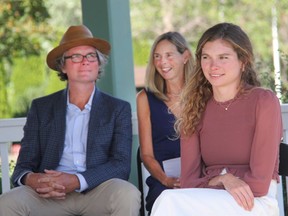 Hometown Olympian Madeleine Kelly (right) was given the Key to the City of Pembroke during a ceremony on Sep. 5 at the Riverwalk Amphitheatre in Pembroke. Looking on her parents, Chris and Caroline Kelly.