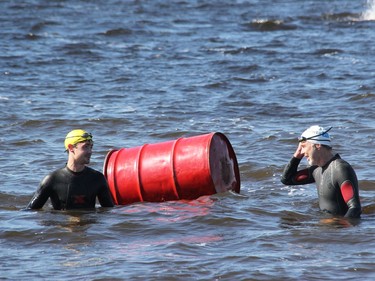 The father/son duo of Peter (right) and Brady Risteen head for shore having touched the barrel to end their three lap swim of the buoys at the mouth of the Pembroke Marina during the 2021 Kiwanis Ottawa River Swim. Anthony Dixon