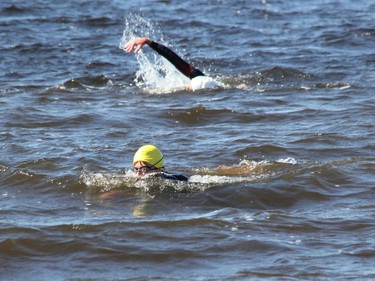 Brady Risteen (foreground) and Peter Risteen make their way around the course during the 2021 Kiwanis Ottawa River Swim.