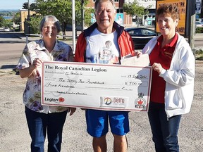 Stan Halliday received a $500 donation from the Royal Canadian Legion Branch 72 in support of his 41st Terry Fox Run. On hand for the cheque presentation when he completed his walk at the legion on Sept. 17 were branch manager Wanda Lavergne (left) and legion bingo chairwoman Laurette Halliday.