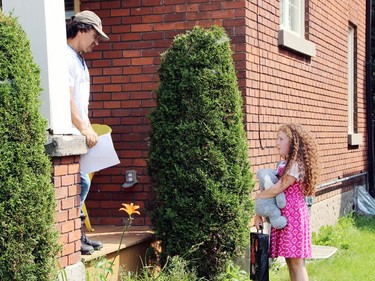 Brian Lutes, writer, director and star of Painted Sharks, shares a scene with EllaGrace Gardner, who plays the young daughter Stephanie, in the film which was shot in parts of the Ottawa Valley, including this scene on Welland Street in Pembroke.
