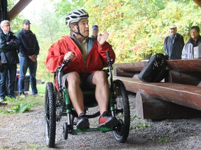 Ian Pineau, Shaw Woods board member and co-ordinator of Algonquin College's outdoor adventure naturalist program, demonstrate the new Shaw Woods Outdoor Education Centre's Mountain Trike all-terrain wheelchair. The vehicle was recently purchased thanks to sponsorships from a handful of area organizations and businesses. It upgrades accesssibility at the outdoor education centre allowing students with mobility challenges to accompany their classmates onto the trails.