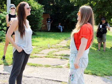 Robynne Eaton (left), who stars as Valerie in Painted Sharks, shares a moment with Cameron Montgomery, who plays her friend Anne, while rehearsing a scene of the movie during a shoot on Welland Street in Pembroke.