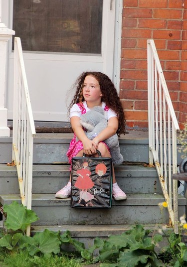 EllaGrace Gardner, who plays the young daughter Stephanie in Painted Sharks, sits patiently while waiting for her cue to meet her new neighbour while shooting a scene in Pembroke this summer.