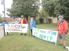 From left, John Rutland, Duane Gastant' Aucoin, Rev. Tiina Cote and Ian Pineau take part in ECO Pembroke's awareness demonstration held at the corner of Mackay Street and Pembroke Street East on the Global Day of Climate Action. Anthony Dixon