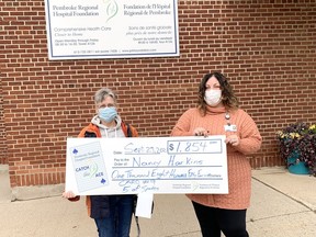 Nancy Harkins (left), winner of the Week #10 Catch the Ace 3.0 lottery draw, accepts her cheque for $1,854 from Leigh Costello, community fundraising specialist with the Pembroke Regional Hospital Foundation.