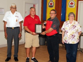 Stan Halliday, president of Royal Canadian Legion Branch 72 (second from left) was awarded the Palm Leaf to the Meritorious Service Medal during a Zone G7 meeting in Pembroke. Also taking part in the presentation (from left) veteran Bob Handspiker, Branch 72 honours and awards officer; Wayne Bennett, Zone commander and Wanda Lavergne, Branch 72 manager.