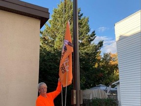 Township of Whitewater Region Mayor Mike Moore raises the Every Child Matters flag outside the municipal officers in Cobden on Sept. 28, 2021.