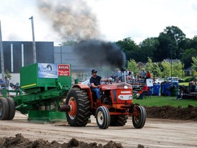 Kilsyth's Andrew Algera drives his 1967 Nuffield in the antique tractor pull Saturday during the scaled-down Owen Sound Fall Fair at Victoria Park. This year's event included only antique tractor pulls, regional 4-H shows and a drive-thru barbecue due to the pandemic, which forced organizers to cancel the midway, demolition derby, kid's activities and entertainment. DENIS LANGLOIS