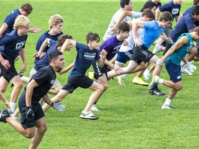 CCH Crusader football players sprint during practice after school in London on Sept. 14. Derek Ruttan/Postmedia Network