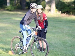 (From left to right): Lily Rumiel and Marjorie Hall enjoying the social and physical aspects of trail riding out at Kinsmen Park. Rumiel is one of the 48 registered riders participating in the Kids Shredding Singletrack program, as part of the Sault Cycling Club. The club of riders and instructors spend Tuesday evenings out at Kinsmen, trail-riding between 6 p.m. to 8 p.m.
