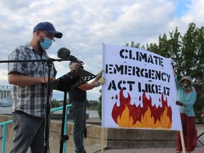 Trevor Jamieson, one of the organizers of a climate change rally and march Wednesday evening in Sarnia, speaks at the Flag Court in Centennial Park.