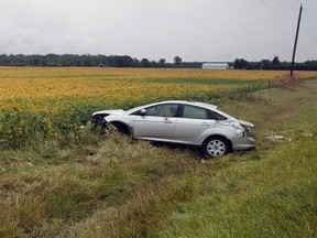 Three people were rushed to hospital and the driver was charged after a single-car rollover on Oil Heritage Road north of Michigan Line on Thursday, Sept. 9, 2021, Lambton OPP say. (Lambton OPP)