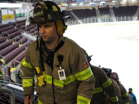 Firefighters climb the stairs inside Progressive Auto Sales Arena during a 20th anniversary 9/11 memorial fundraising event on Saturday, Sept. 11, 2021, in Sarnia, Ont. Terry Bridge/Sarnia Observer/Postmedia Network