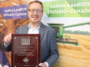 Stephen Thompson, CEO of the Sarnia-Lambton Economic Partnership, holds a previous award the agency received for being named one of Canada's Best Locations by Site Selector magazine. The agency made the list again recently, for the fourth year in a row.