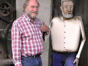 Charlie Fairbank poses with a metal sculpture of his likeness created by welding artist Murray Watson. Fairbank Oil Fields marked its 160th anniversary earlier this year. (Handout)