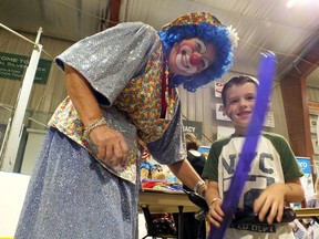 A clown and a young fair-goer are shown in this file photo at a previous Brooke-Alvinston and Watford Fall Fair. This year's fair runs this weekend, with all activities being held outdoors to follow public health rules.