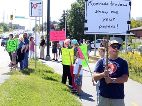 Protesters gather on Paris Street in front of Health Sciences North and Public Health Sudbury and Districts on Wednesday, September 1, 2021, for a Rally for Medical Freedom to show their opposition to COVID-19 vaccine mandates and other restrictions. Ontario government officials announced on Wednesday that, effective Sept. 22, proof of vaccination will be required to attend many indoor businesses and facillities. Ben Leeson/The Sudbury Star/Postmedia Network